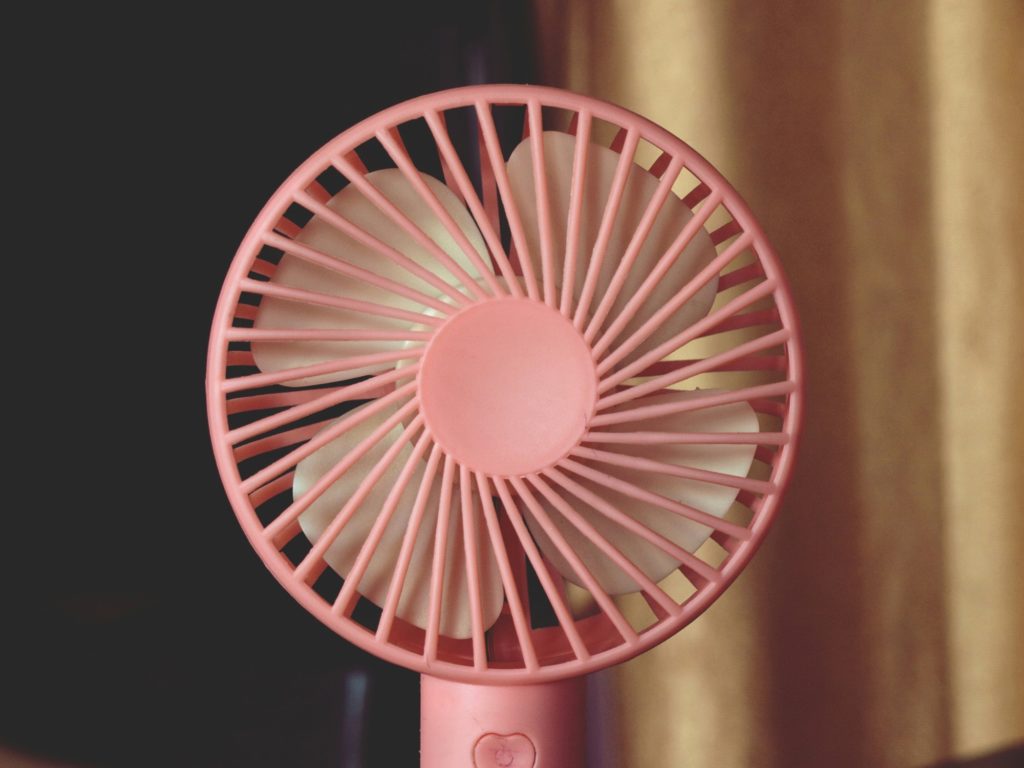 Portable pink fan for menopause relief